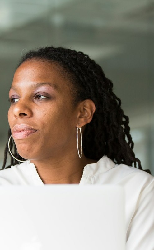 Professional woman working on a laptop in a modern office